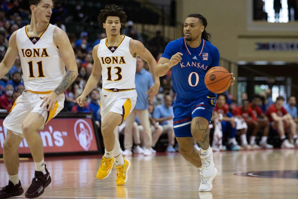 Kansas Jayhawks guard Bobby Pettiford (0) dribbles the ball against Iona Gaels in the first half at HP Field House on Sunday, Nov 28, 2021.
