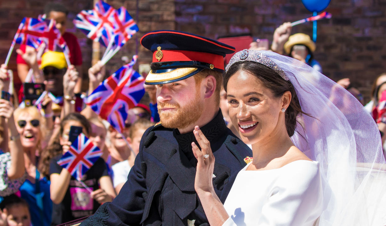 Prince Harry and Meghan Markle, Duke and Duchess of Sussex, during the Carriage Procession of their wedding in Windsor, Berkshire, UK. (Photo by DPPA/Sipa USA)