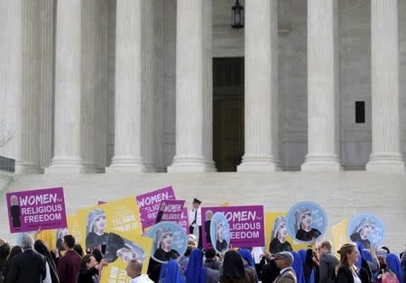 Nuns rally before Zubik v. Burwell, an appeal brought by Christian groups demanding full exemption from the requirement to provide insurance covering contraception under the Affordable Care Act, is heard by the U.S. Supreme Court in Washington, March 23, 2016. REUTERS/Joshua Roberts