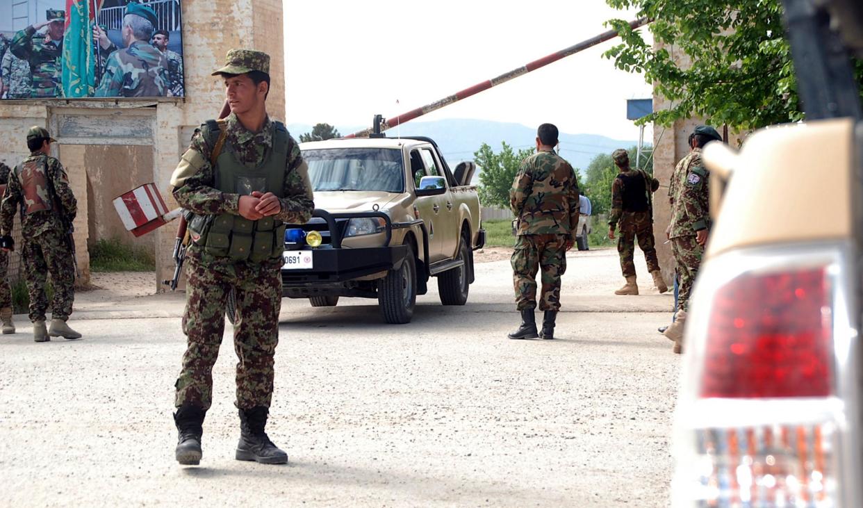 A soldier stands guard following the attack: EPA