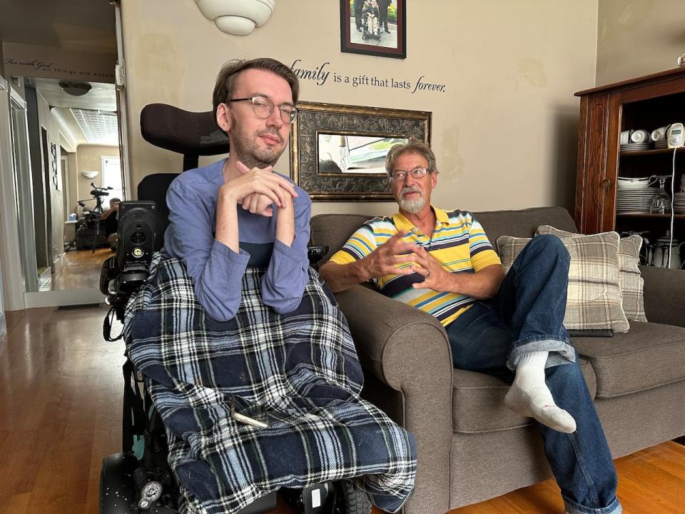 Luke Marchant (left) and his father Winton Marchant in their home in Windsor's Riverside area.