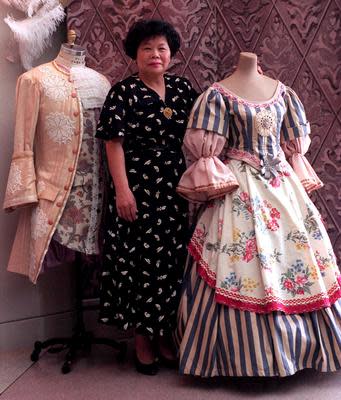 Lucy Ho poses with costumes designed for Florida State University Opera in this file photo.