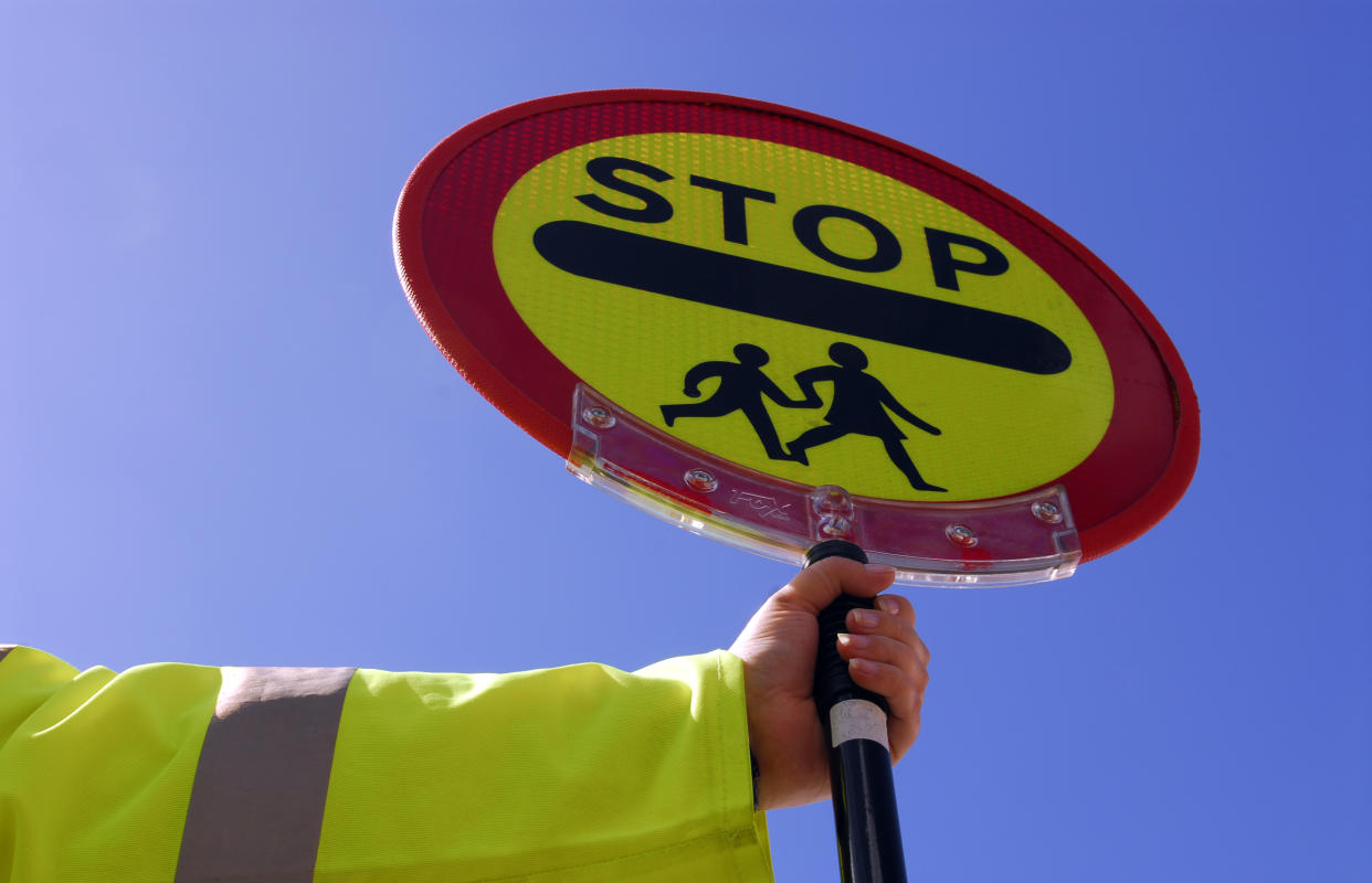 School crossing patrol UK. (Photo by Photofusion/Universal Images Group via Getty Images)