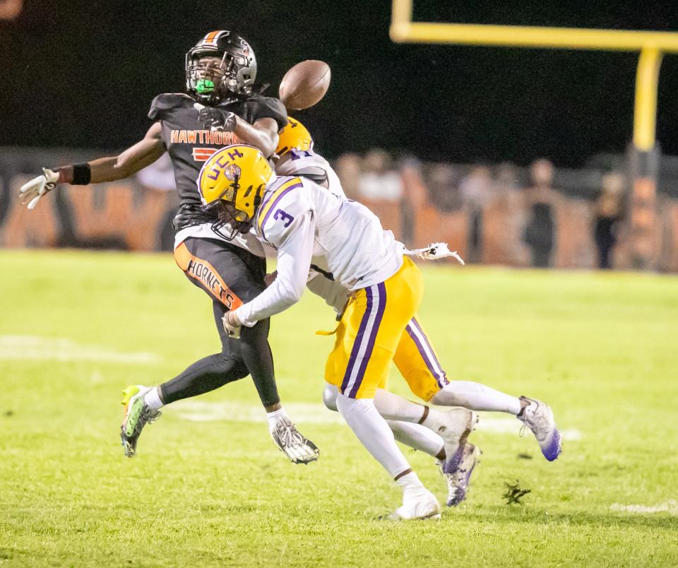 Union County Fightin' Tigers Gavin Jenkins (3) breaks up a pass intended for Hawthorne Hornets wide receiver Alvon Isaac (2) as the Hawthorne Hornets takes on the Union County Fightin’ Tigers at Hawthorne High School in Hawthorne, FL on Friday, October 13, 2023. [Alan Youngblood/Gainesville Sun]