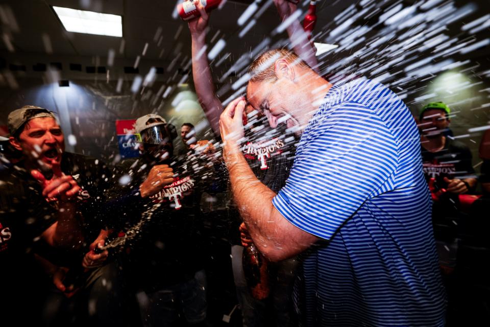 Rangers GM Chris Young celebrates in the clubhouse after the Rangers' Game 7 win.