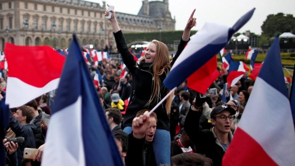 Supporters of Emmanuel Macron celebrate near the Louvre.