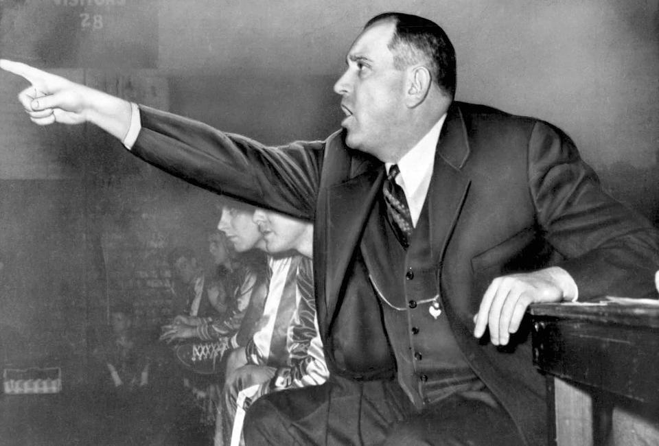 FILE - University of Kentucky coach Adolph Rupp gestures from the bench in Lexington, Ky., in January 1954. (AP Photo/File)