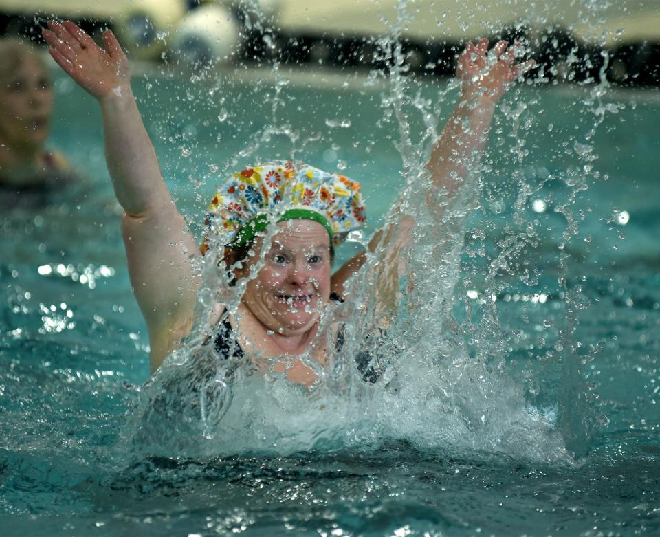 Leslie Larkins splashes the water up during her favorite song in her Zumba aquatic class at the Monroe Family YMCA.