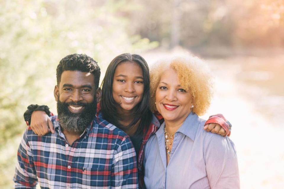 Richard Dean, left, and Venitra White-Dean, right, with daughter Aubree Dean.