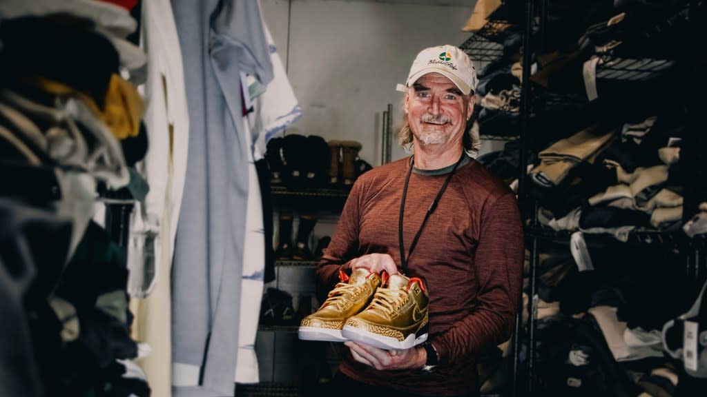 This photo provided by the Portland Rescue Mission shows James Free posing for a photo with a pair of of gold Nike Air Jordan 3 sneakers at the Portland Rescue Mission on Sunday, Oct. 30, 2023, in Portland, Ore. The sneakers, designed in 2019 for filmmaker Spike Lee, that were donated to the homeless shelter, sold for nearly $51,000 at auction on Monday, Dec. 18. (Photo by Aaron Ankrom/Portland Rescue Mission via AP)