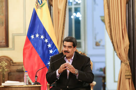 Venezuela's President Nicolas Maduro speaks during a meeting with members of the Venezuelan diplomatic corp after their arrival from the United States, at the Miraflores Palace in Caracas, Venezuela January 28, 2019. Miraflores Palace/Handout via REUTERS