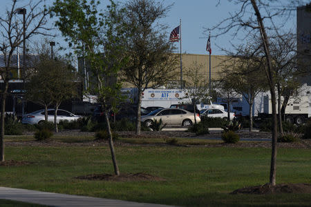 Law enforcement vehicles are seen outside FedEx facility following a blast, in Schertz, Texas, U.S., March 20, 2018. REUTERS/Sergio Flores