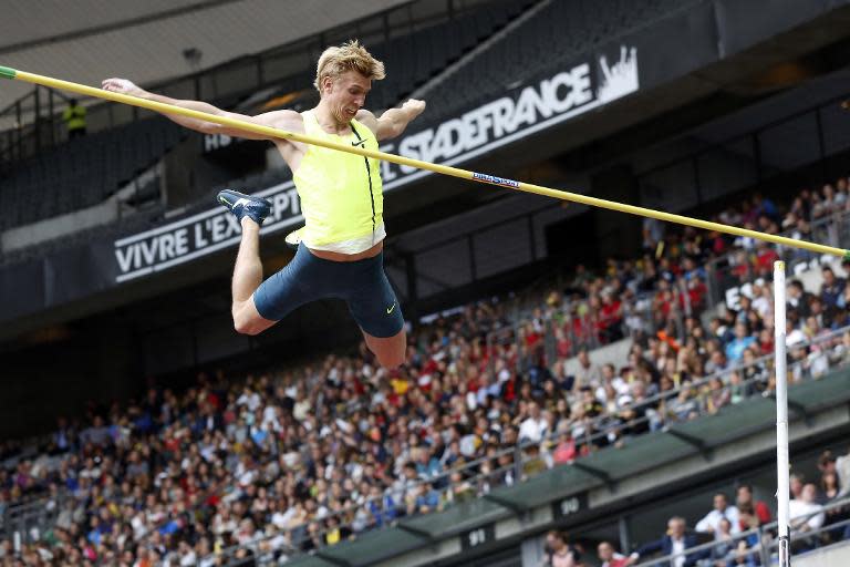 Poland's Piotr Lisek competes in the men's pole vault event during the IAAF Diamond League competition at Stade de France on July 5, 2014