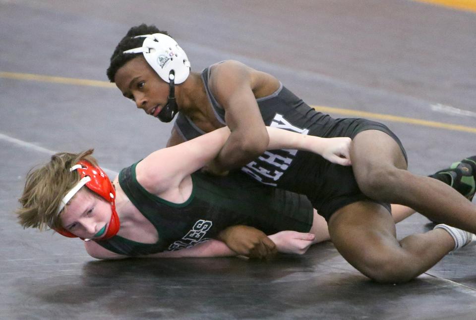 Charles Curtis (right) of Perry defeated Finn Peeler of GlenOak in a 106 pound bout at Perry on Thursday, Jan. 7, 2021. 