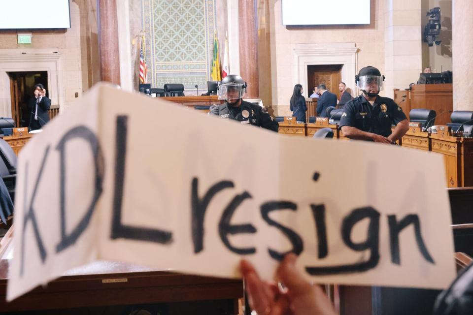 People protest Kevin de León at Los Angeles City Hall.