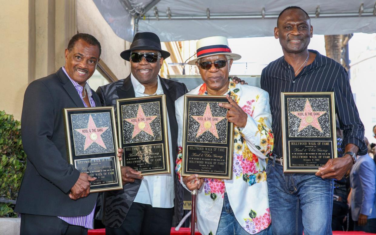 Robert "Kool" Bell, left, Ronald "Khalis" Bell, Dennis "DT" Thomas and George Brown attend a ceremony honouring Kool & The Gang with a star on The Hollywood Walk of Fame in 2015 - Rich Fury/Invision/AP