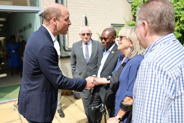 <p>Chris Jackson/Getty Images</p> Prince William greets supporters like DJ Sara Cox in Lambeth, London