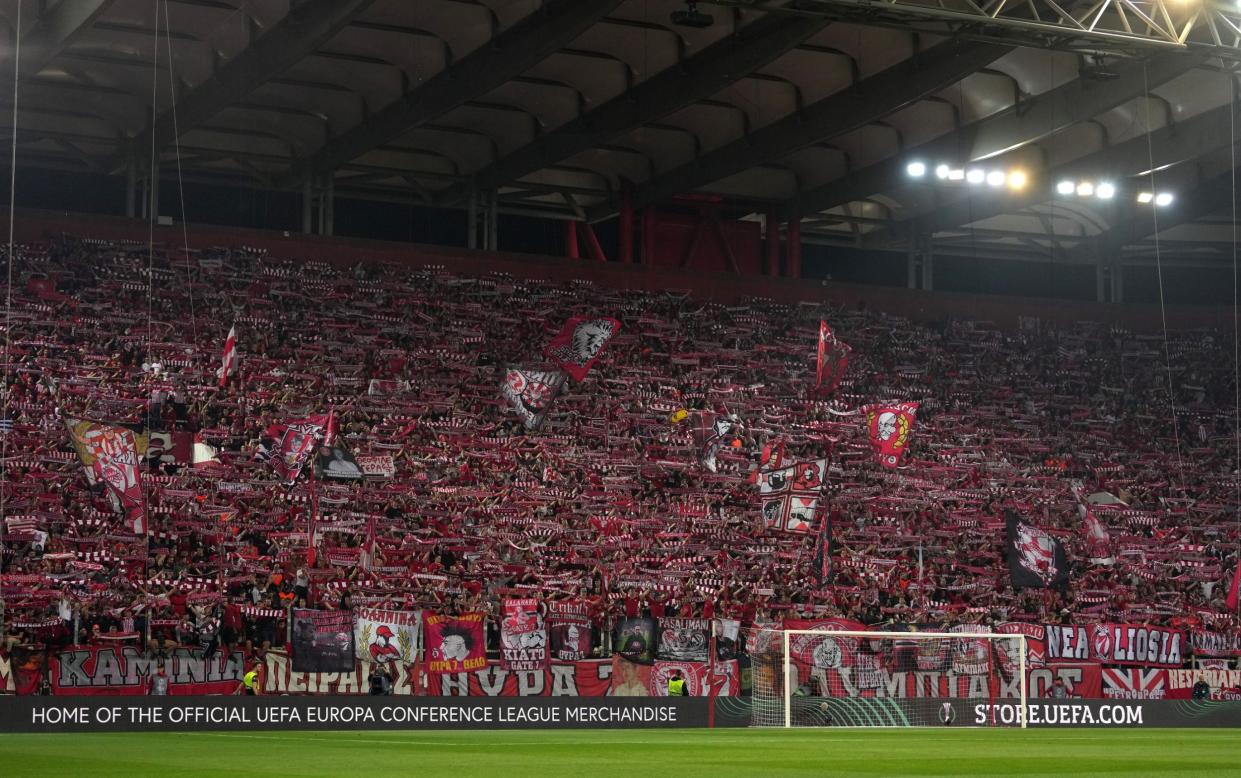 The Olympiacos fans show their support just before kick-off