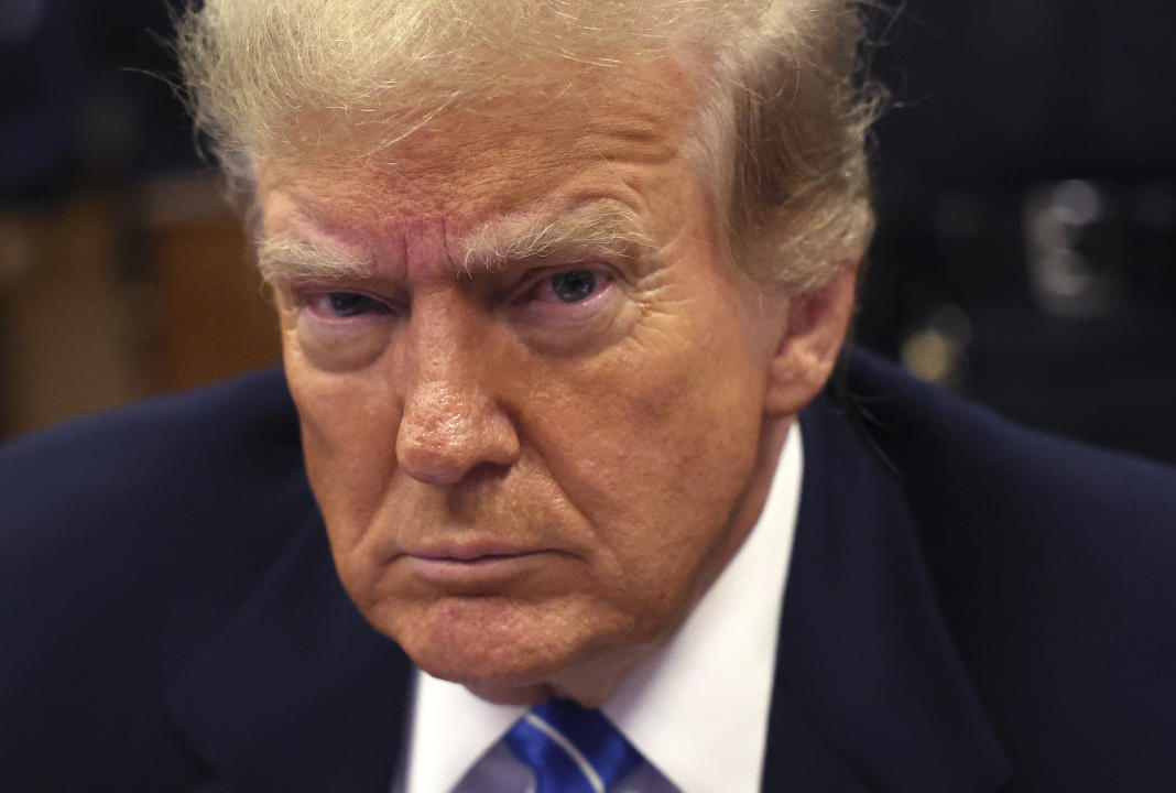 Former President Donald Trump waits for the start of proceedings in his hush money trial at Manhattan criminal court on Monday.