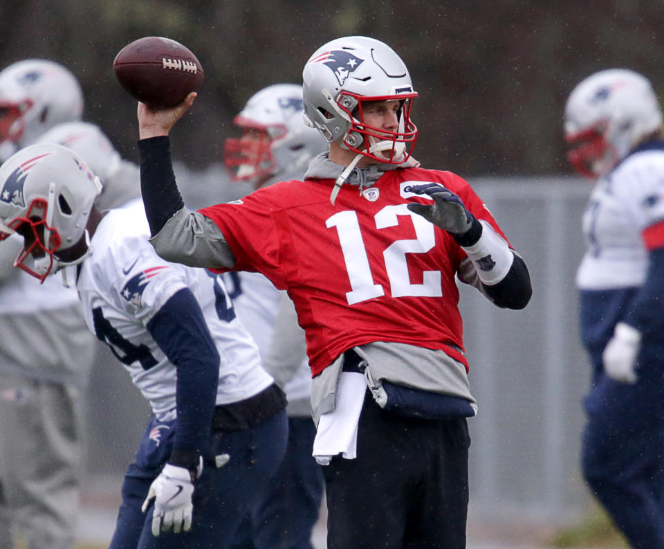 New England Patriots quarterback Tom Brady, shown here at practice on Wednesday, was added to the team's injury report on Friday. (Jonathan Wiggs/Globe Staff/Getty Images)