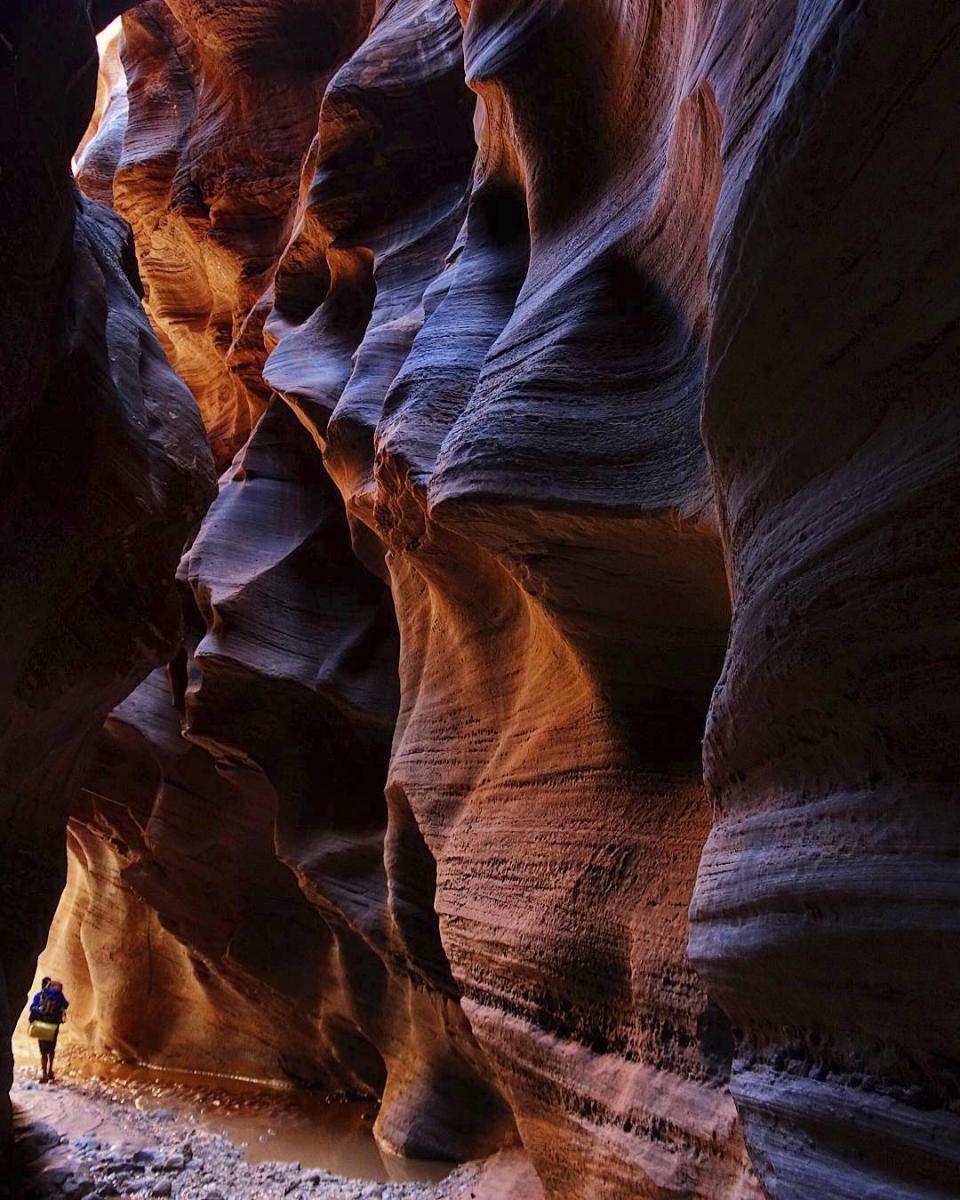 Sunlight peeks into the narrows of Buckskin Gulch in Kane County, Utah, on Sunday, Sept. 25, 2016. One man is dead and another is still missing after floodwaters poured into a slot canyon in southern Utah, endangering three groups of hikers who had to be hoisted out via helicopter Tuesday, March 14, 2023. The hikers were on a multi-day trek from Wire Pass to Lees Ferry through Buckskin Gulch's sandstone features that includes multiple narrow slot canyons.(Lennie Mahler /The Salt Lake Tribune via AP)