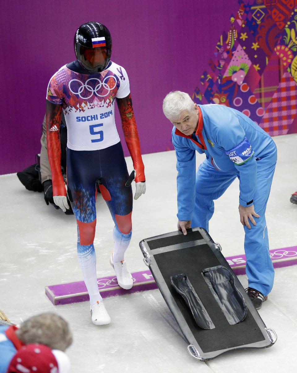 Alexander Tretiakov of Russia starts his first run during the men's skeleton competition at the 2014 Winter Olympics, Friday, Feb. 14, 2014, in Krasnaya Polyana, Russia. (AP Photo/Michael Sohn)