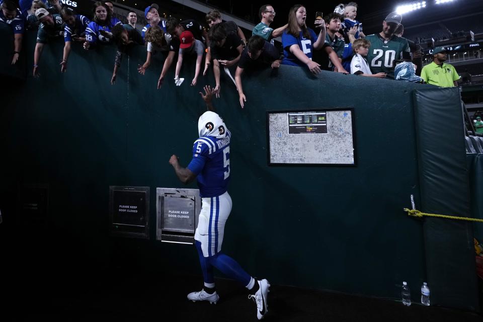 Indianapolis Colts quarterback Anthony Richardson (5) high fives fans after an NFL preseason football game against the Philadelphia Eagles on Thursday, Aug. 24, 2023, in Philadelphia. (AP Photo/Matt Slocum)