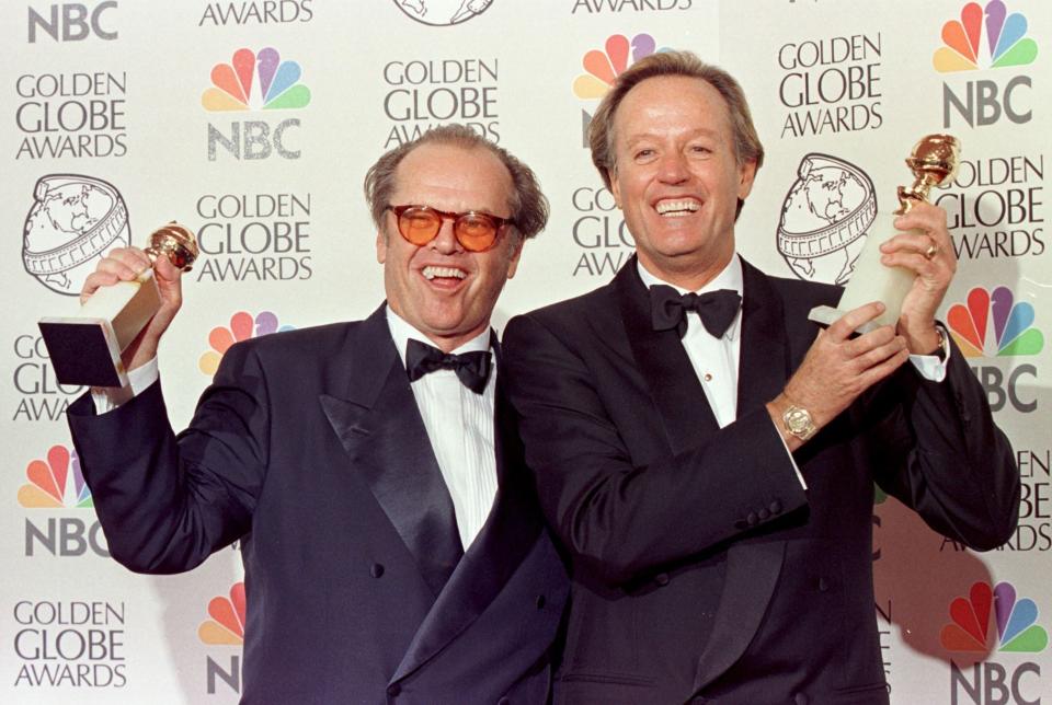 Jack Nicholson (left) and Peter Fonda (right) hold their Golden Globe awards for Best Actor in January 18, 1998 (AFP/Getty Images)