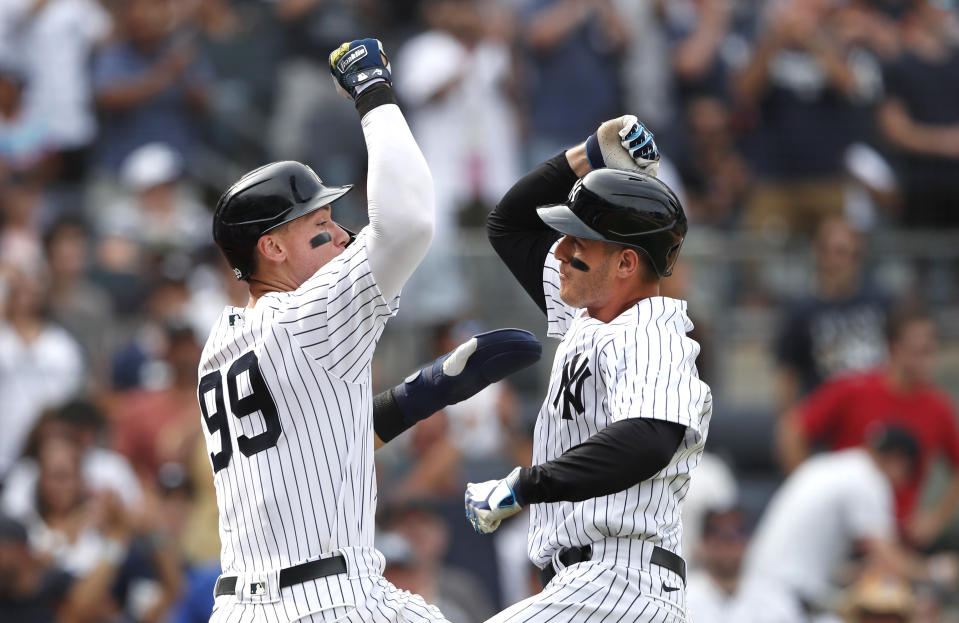 New York Yankees' Aaron Judge (99) celebrates with Anthony Rizzo, right, after Rizzo's home run against the Kansas City Royals during the seventh inning of a baseball game Sunday, July 31, 2022, in New York. (AP Photo/Noah K. Murray)