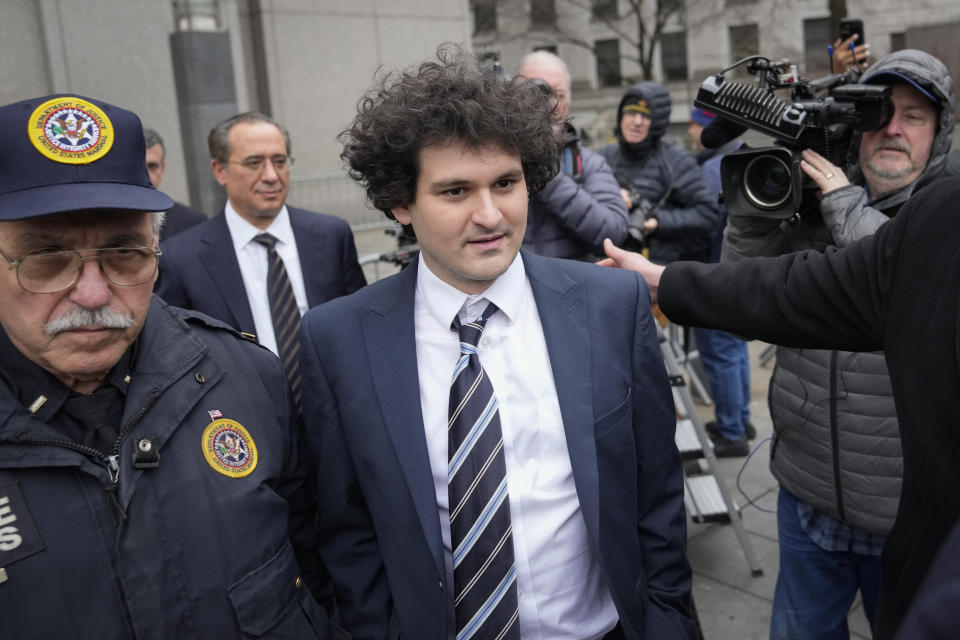 Samuel Bankman-Fried departs Manhattan federal court in New York, Thursday, Feb. 9, 2023, in New York. (AP Photo/John Minchillo)