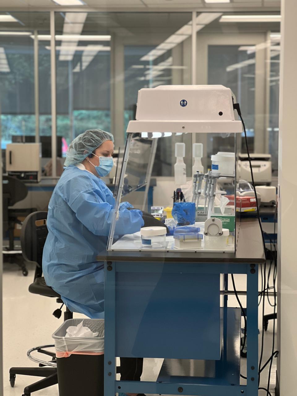 A worker at Othram’s lab in Houston is pictured working with samples.