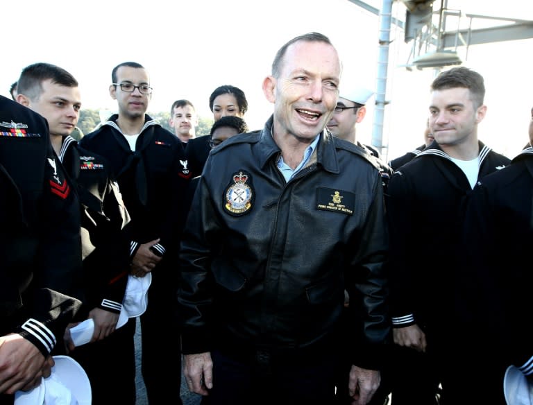 Australian Prime Minister Tony Abbott (C) meets US sailors on board the USS Blue Ridge in Sydney Harbour on July 3, 2015, ahead of the joint Australia-US-Japan military exercises, known as the Talisman Sabre Operation, which start on July 5