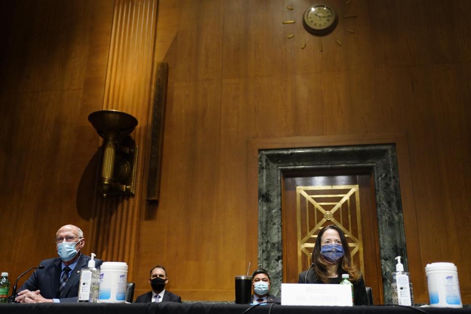 Former Director of National Intelligence Daniel Coats, left, and President-elect Joe Biden’s pick for national intelligence director Avril Haines attends a confirmation hearing for Haines before the Senate intelligence committee on Tuesday, Jan. 19, 2021, in Washington. (Melina Mara/The Washington Post via AP, Pool)