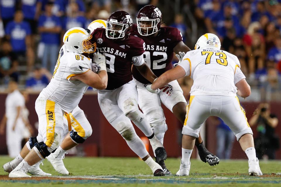 Kent State right guard Nate Monnin (left) blocks a Texas A&M defender during the 2021 season opener in College Station.