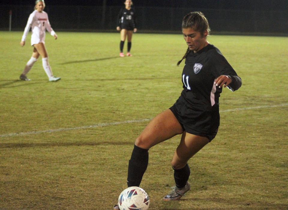 Bartram Trail forward Brooke Gosse (11) dribbles along the sideline against Creekside during a November game.