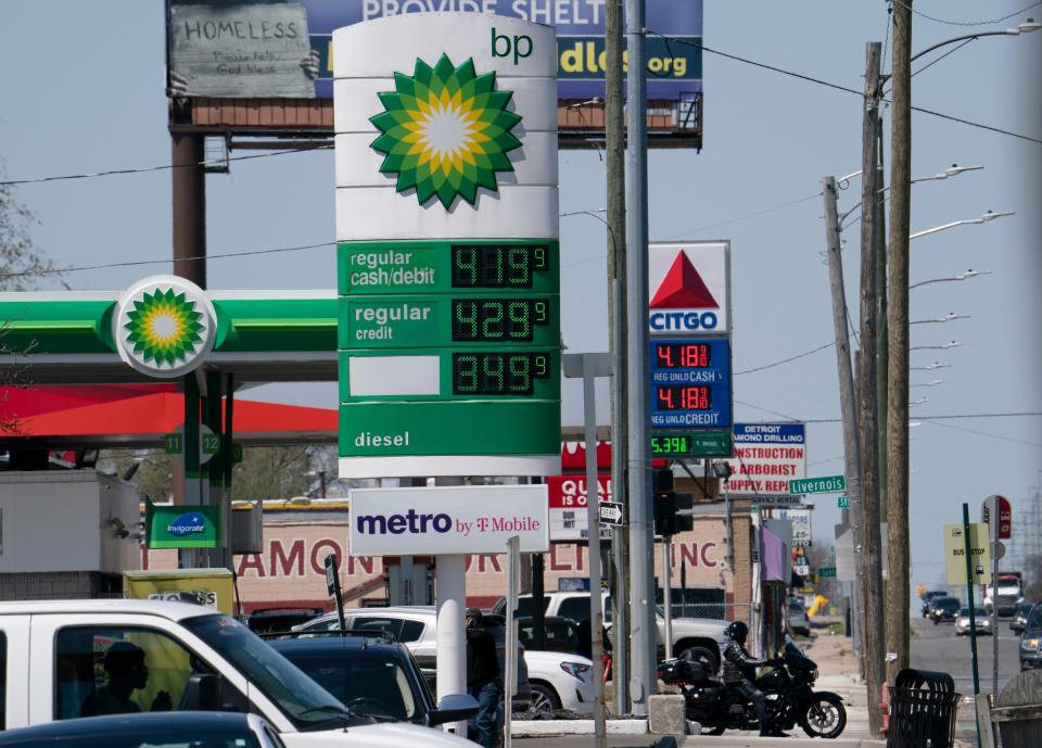 Gas prices are displayed on signs on the Detroit side of 8 Mile Monday, May 9, 2022.