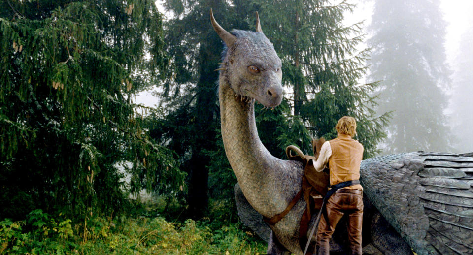 Edward Speleers with a dragon in the movie "Eragon"