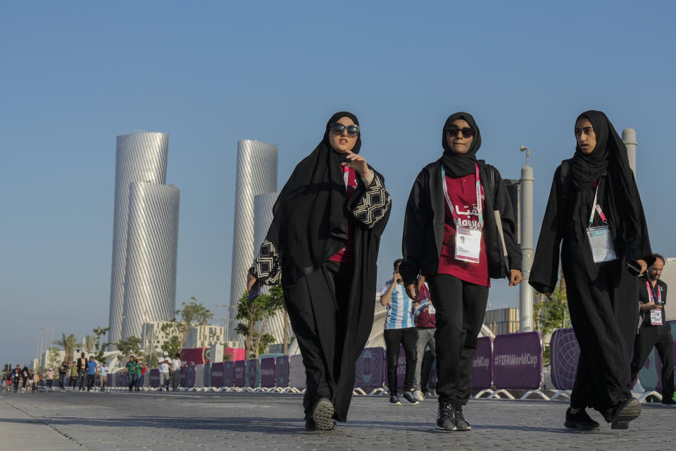 People walk outside the Lusail stadium during a match between Saudi Arabia and Argentina in Lusail, Qatar, Tuesday, Nov. 22, 2022. (AP Photo/Andre Penner)