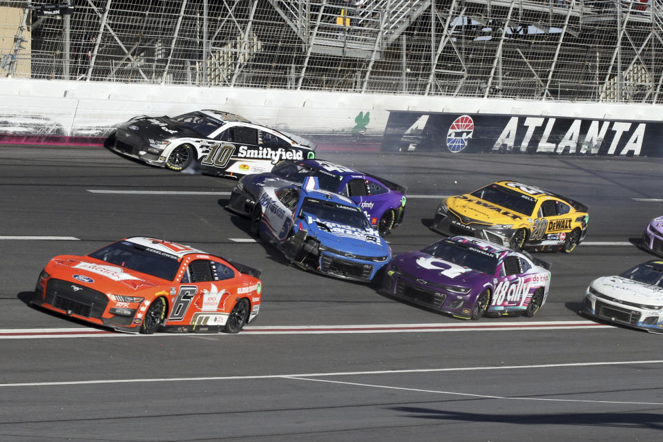 Aric Almirola (10), Tyler Reddick (45), Kyle Larson (5), and Alex Bowman (48) wreck exiting Turn 4 during the NASCAR Cup Series auto race at Atlanta Motor Speedway, Sunday, March 19, 2023, in Hampton, Ga. (AP Photo/Skip Williams)