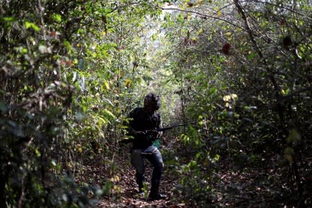 The Wider Image: Fighting fire with fire, Amazon 'forest guardians' stalk loggers