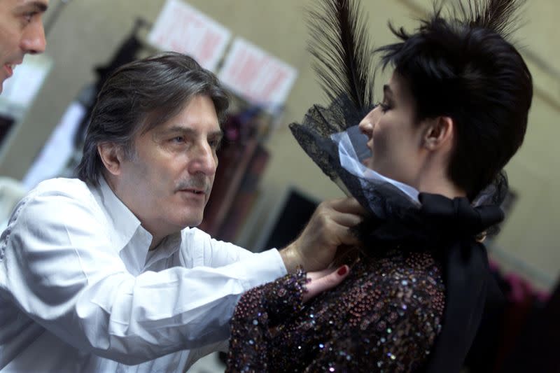 FILE PHOTO: Italian designer Emanuel Ungaro makes last-minute preparations backstage prior to the presentation of his 2001/2002 autumn-winter Haute Couture collection in Paris