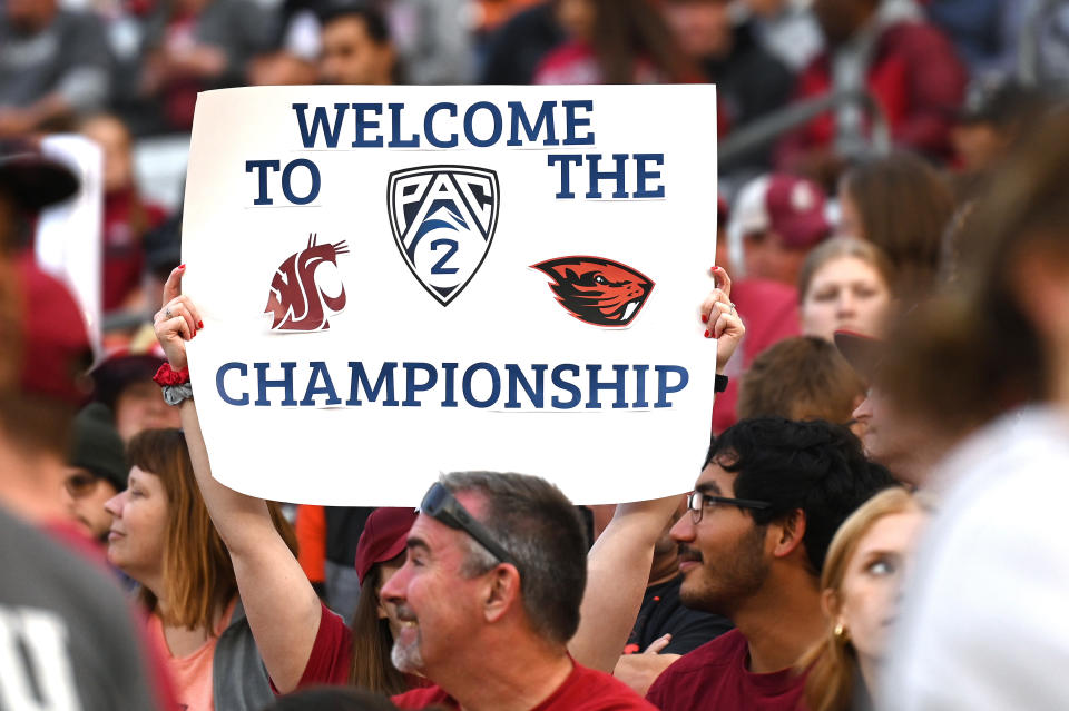 A Washington State fan holds up a Pac-2 sign during a game against Oregon State on Sept. 23. (James Snook-USA TODAY Sports)