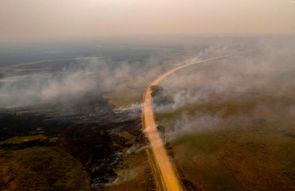 Smoke billows from fires near the Transpantaneira road on Sept. 14.<span class="copyright">Mauro Pimentel—AFP/Getty Images</span>