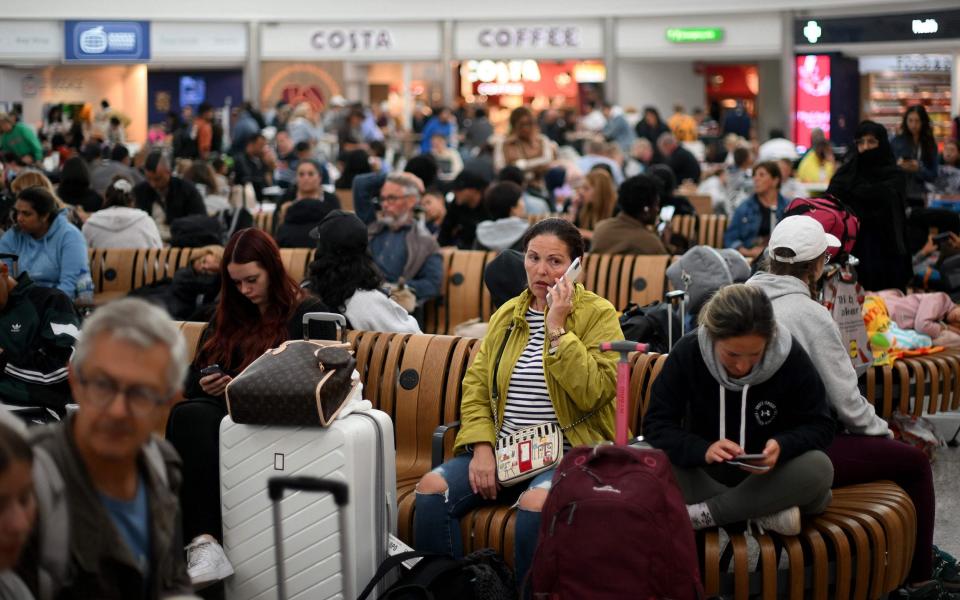 Passengers wait at Stansted Airport