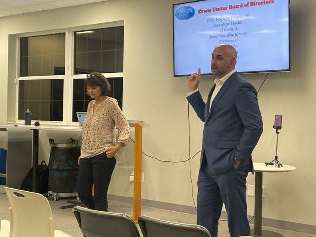 Executive Director Lynn Brockwell-Carey and Peter Mannino, chairman of the Evans Center board and the immediate past president of NeighborUp, give a presentation to community leaders about financial struggles of the Evans Center in Palm Bay