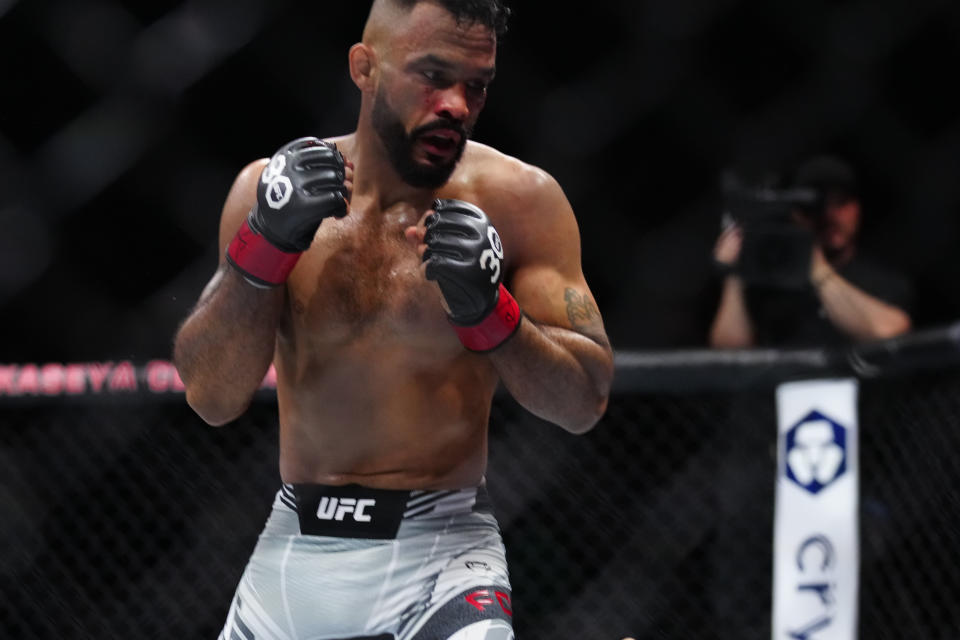 Apr 8, 2023; Miami, Florida, USA; Rob Font (red gloves) fights Adrian Yanez (blue gloves) during UFC 287 at Miami-Dade Arena. Mandatory Credit: Rich Storry-USA TODAY Sports