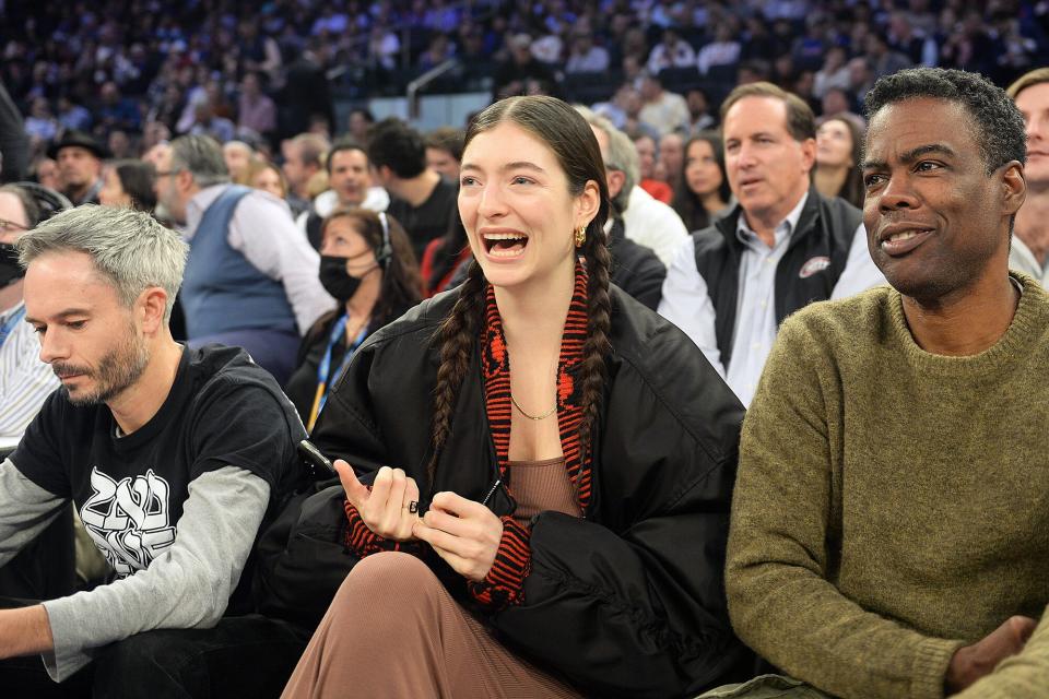 Lorde with boyfriend Justin Warren, Chris Rock at the Milwaukee Bucks vs. the New York Knicks game at Madison Square Garden.