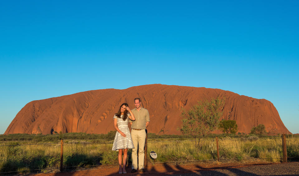 Prince William, Duke of Cambridge and Catherine, Duchess of Cambridge view Ayers Rock at sunset on April 22, 2014 in Ayers Rock, Australia. The Duke and Duchess of Cambridge are on a three-week tour of Australia and New Zealand, the first official trip overseas with their son, Prince George of Cambridge.  