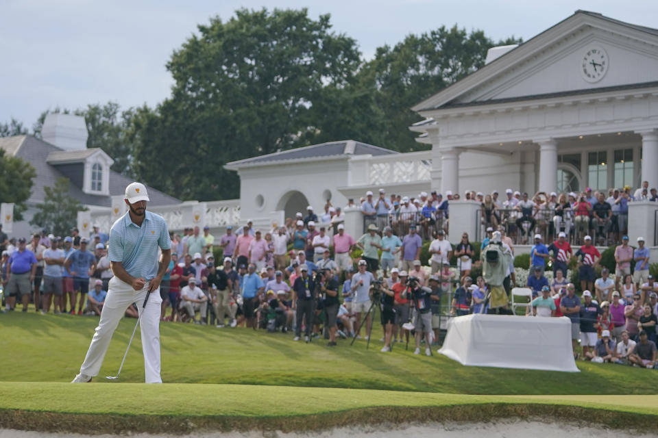 Max Homa reacts to his putt on the 15th green during their foursomes match at the Presidents Cup golf tournament at the Quail Hollow Club, Thursday, Sept. 22, 2022, in Charlotte, N.C. (AP Photo/Julio Cortez)