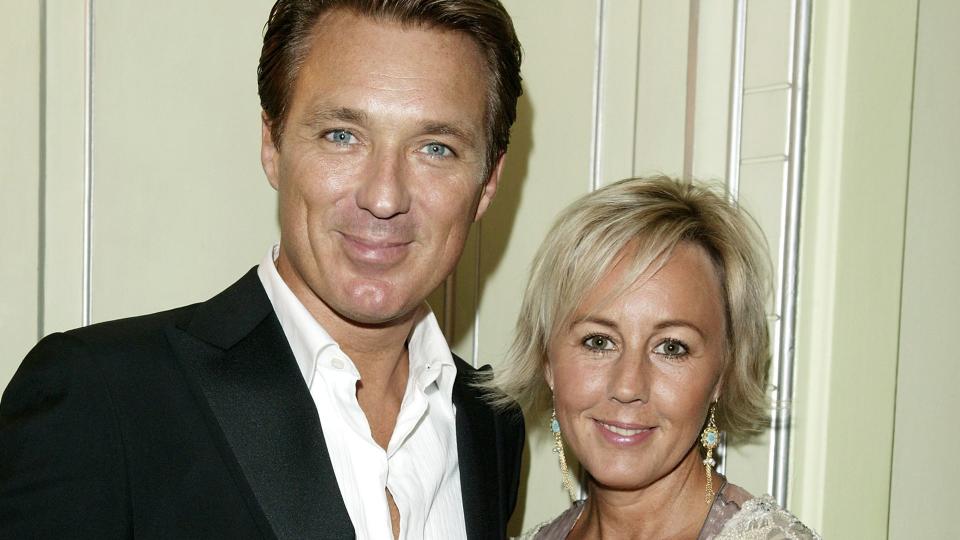 Martin Kemp in a suit and his wife Shirlie in a white lace top